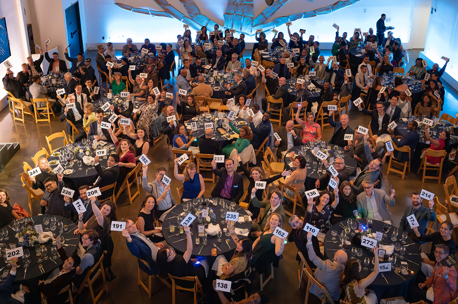 Guests bidding at Mighty Real 25
